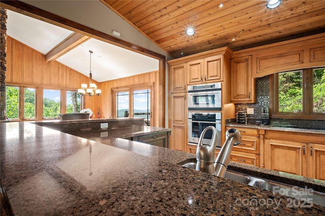 2045 Hogback Mountain Rd, Tryon, NC 28782 - kitchen featuring vaulted ceiling, a chandelier, decorative backsplash, stainless steel double oven, and wooden ceiling