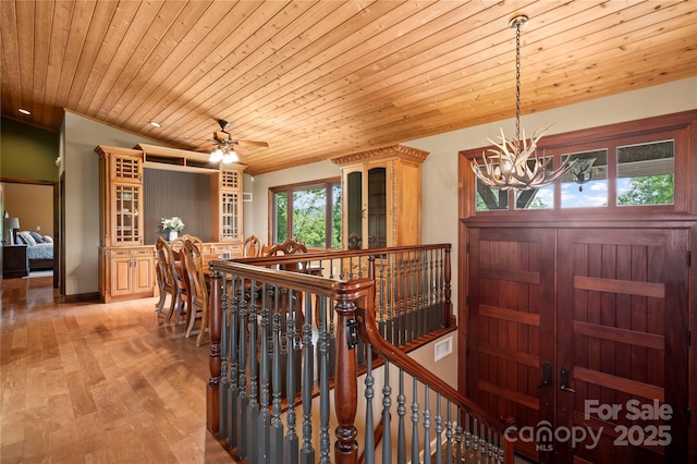 2045 Hogback Mountain Rd, Tryon, NC 28782 - foyer featuring a chandelier, wood ceiling, a ceiling fan, and light wood-style flooring