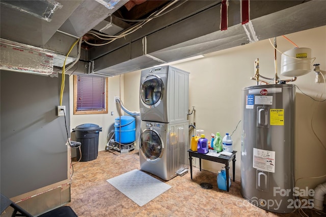 2045 Hogback Mountain Rd, Tryon, NC 28782 - washroom featuring stacked washer / dryer and electric water heater