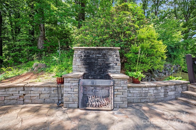 2045 Hogback Mountain Rd, Tryon, NC 28782 - view of patio featuring an outdoor stone fireplace