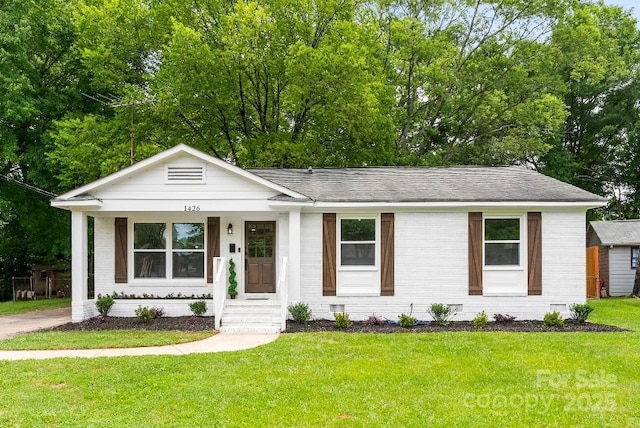 1426 Larkfield Ln, Charlotte, NC 28210 - view of front of property featuring brick siding, a front lawn, and roof with shingles