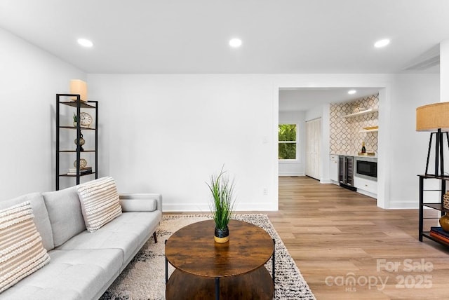 1426 Larkfield Ln, Charlotte, NC 28210 - living area featuring beverage cooler, recessed lighting, and light wood-style floors