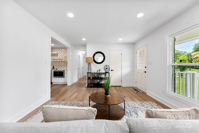 1426 Larkfield Ln, Charlotte, NC 28210 - living area featuring healthy amount of natural light, recessed lighting, and wood finished floors
