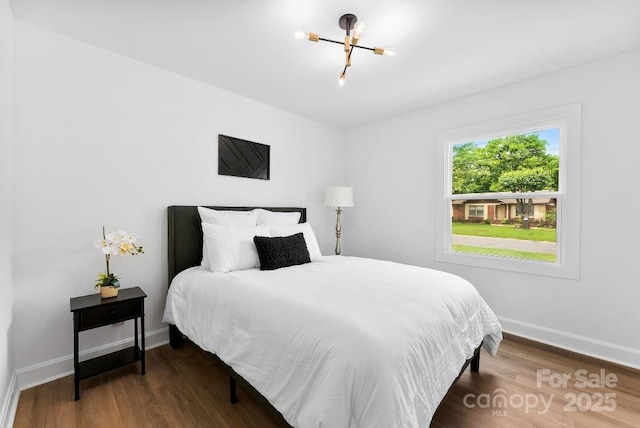 1426 Larkfield Ln, Charlotte, NC 28210 - bedroom featuring a chandelier and wood finished floors