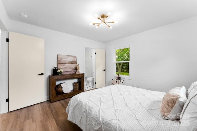 1426 Larkfield Ln, Charlotte, NC 28210 - bedroom with a chandelier and wood finished floors