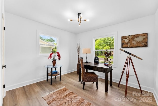 1426 Larkfield Ln, Charlotte, NC 28210 - home office with a chandelier and light wood finished floors