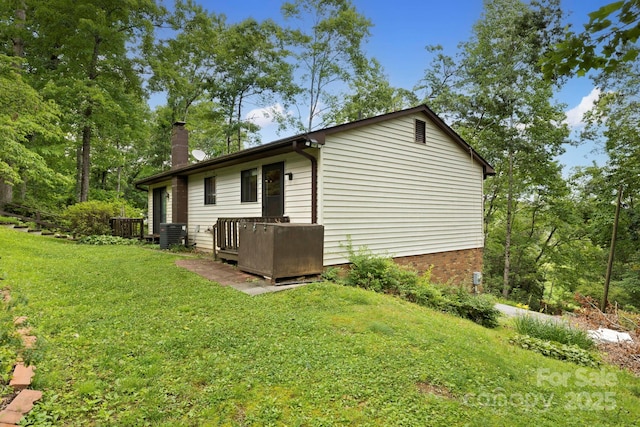 108 Deer Run Rd, Mills River, NC 28759 - view of home's exterior featuring a chimney, a deck, and a yard