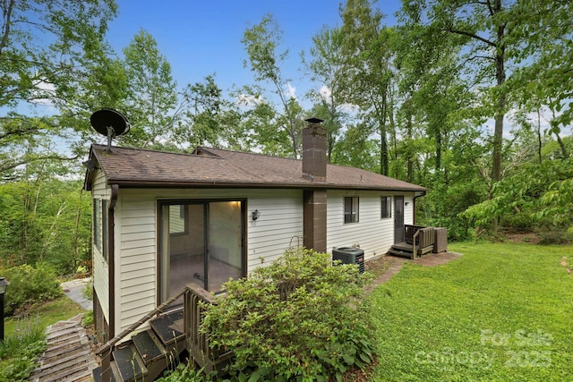 108 Deer Run Rd, Mills River, NC 28759 - rear view of property with a chimney and a lawn