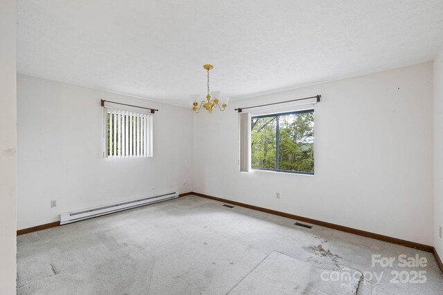 108 Deer Run Rd, Mills River, NC 28759 - carpeted empty room featuring baseboard heating and a chandelier