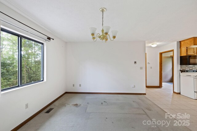 108 Deer Run Rd, Mills River, NC 28759 - unfurnished dining area with a chandelier and baseboards