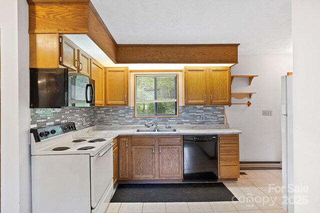 108 Deer Run Rd, Mills River, NC 28759 - kitchen with black appliances, light countertops, decorative backsplash, and light tile patterned floors