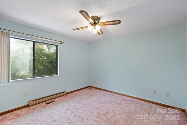 108 Deer Run Rd, Mills River, NC 28759 - spare room featuring baseboard heating, a ceiling fan, carpet floors, and a textured ceiling
