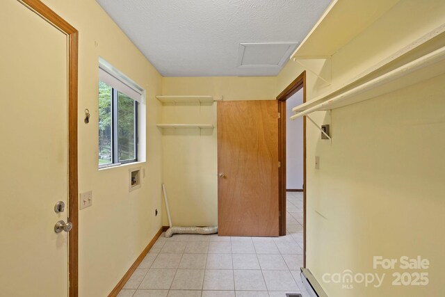 108 Deer Run Rd, Mills River, NC 28759 - laundry area with washer hookup, light tile patterned flooring, a textured ceiling, and attic access