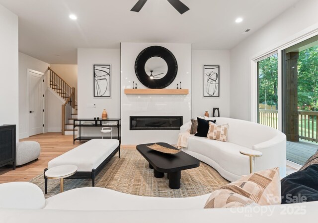 1622 Burtonwood Cir, Charlotte, NC 28212 - living area with stairs, wood finished floors, ceiling fan, a fireplace, and recessed lighting