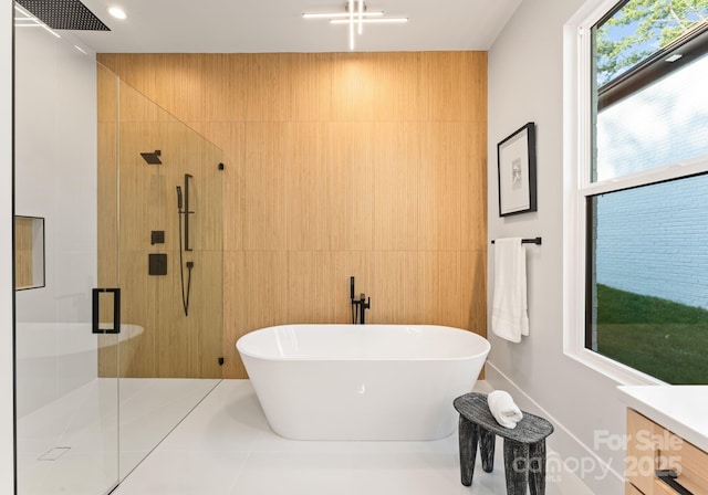 1622 Burtonwood Cir, Charlotte, NC 28212 - bathroom featuring a stall shower, a soaking tub, tile walls, and vanity