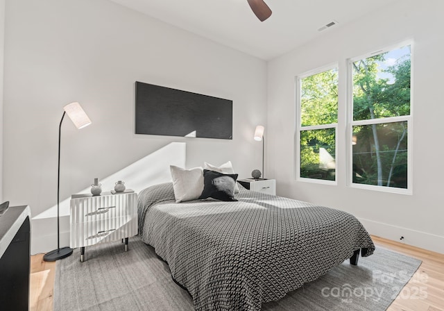 1622 Burtonwood Cir, Charlotte, NC 28212 - bedroom with light wood-style flooring and ceiling fan