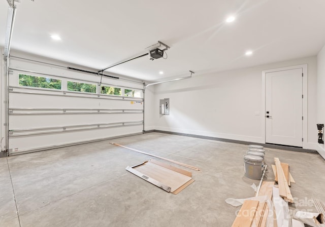 1622 Burtonwood Cir, Charlotte, NC 28212 - garage featuring electric panel, recessed lighting, and a garage door opener