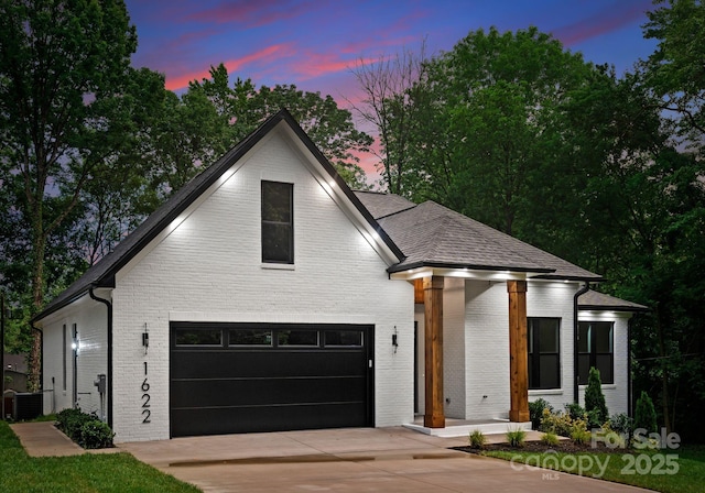1622 Burtonwood Cir, Charlotte, NC 28212 - view of front of house with brick siding, concrete driveway, and an attached garage