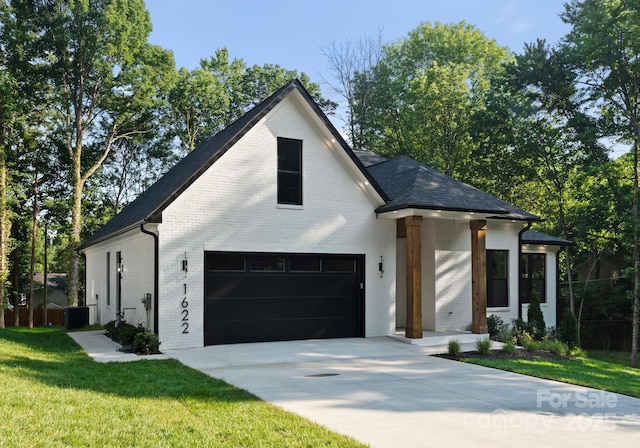 1622 Burtonwood Cir, Charlotte, NC 28212 - view of front of home with brick siding, driveway, a front lawn, and an attached garage