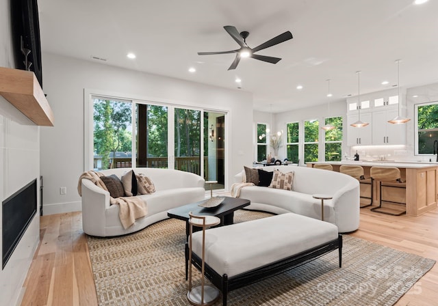 1622 Burtonwood Cir, Charlotte, NC 28212 - living room featuring healthy amount of natural light, light wood-style flooring, recessed lighting, and a ceiling fan