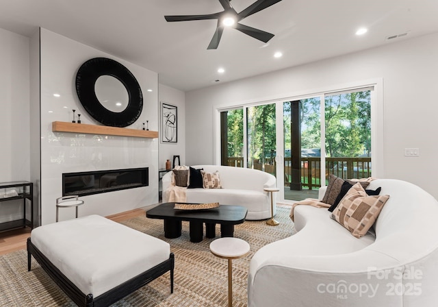 1622 Burtonwood Cir, Charlotte, NC 28212 - living room featuring light wood-style flooring, a high end fireplace, ceiling fan, and recessed lighting