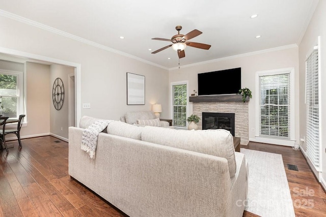 205 Rosedale Ln, Matthews, NC 28105 - living room with dark wood-style flooring, ceiling fan, crown molding, a fireplace, and recessed lighting