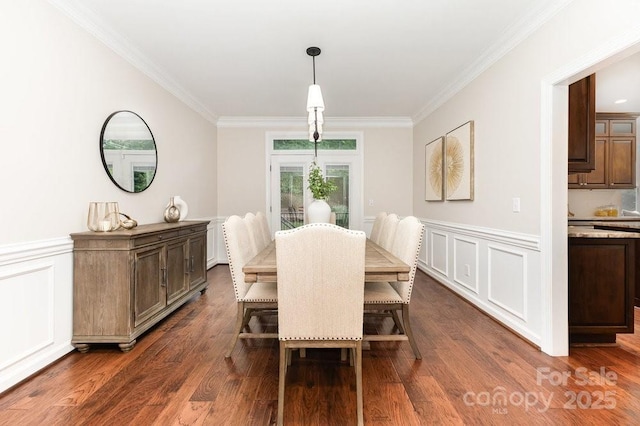205 Rosedale Ln, Matthews, NC 28105 - dining room with ornamental molding, dark wood finished floors, a wainscoted wall, and a decorative wall