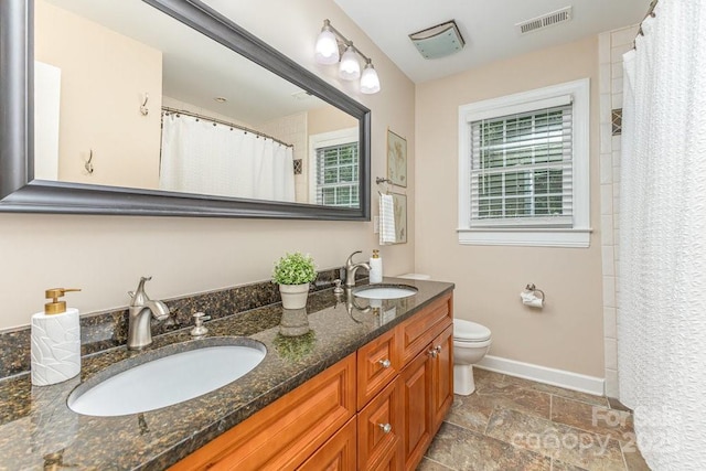205 Rosedale Ln, Matthews, NC 28105 - full bath featuring double vanity, stone tile floors, and a shower with curtain