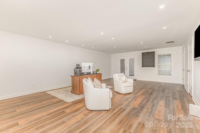 205 Rosedale Ln, Matthews, NC 28105 - sitting room with light wood-style floors and recessed lighting