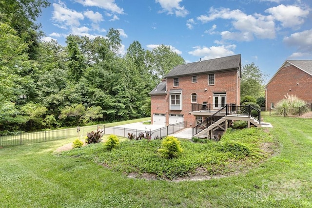 205 Rosedale Ln, Matthews, NC 28105 - rear view of house with a garage, stairs, brick siding, a deck, and a fenced backyard