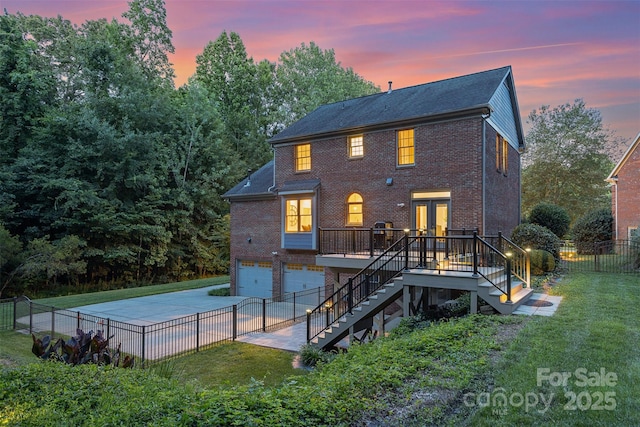 205 Rosedale Ln, Matthews, NC 28105 - rear view of property with stairs, french doors, a garage, driveway, and brick siding