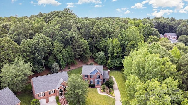 205 Rosedale Ln, Matthews, NC 28105 - aerial view of property and surrounding area featuring a heavily wooded area
