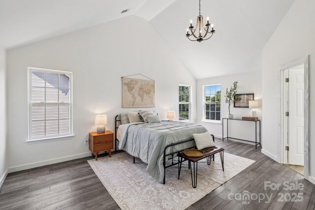 1986 Trace Creek Dr, Waxhaw, NC 28173 - bedroom with a chandelier, high vaulted ceiling, and dark wood finished floors