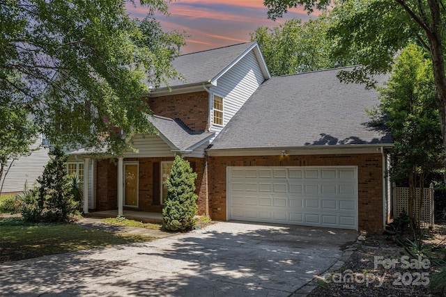 2001 Enderbury Dr, Indian Trail, NC 28079 - traditional-style home with brick siding, concrete driveway, a garage, and roof with shingles