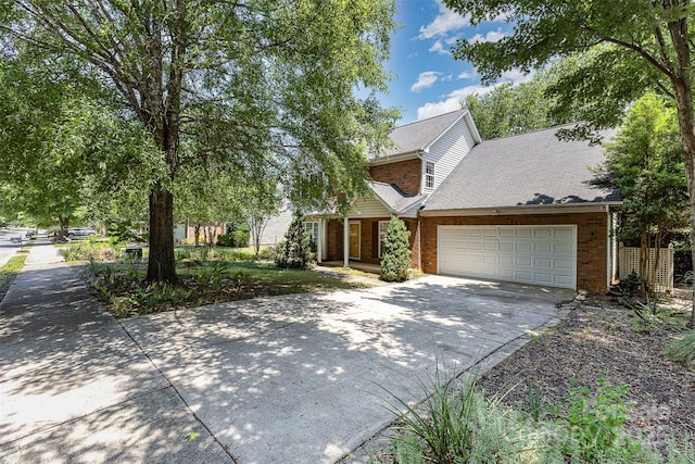 2001 Enderbury Dr, Indian Trail, NC 28079 - view of front facade with concrete driveway, brick siding, and an attached garage