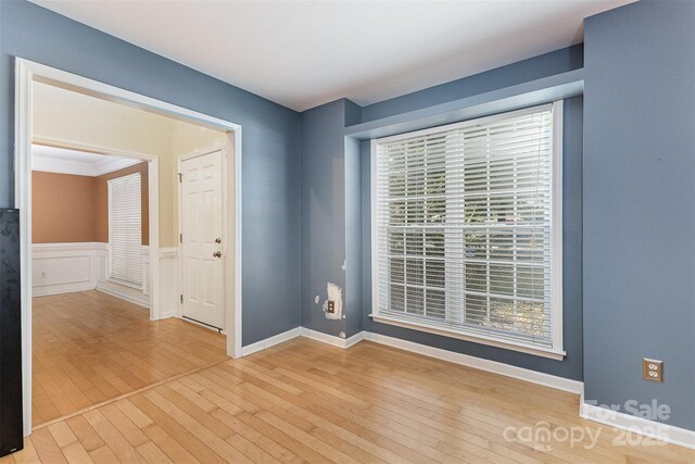 2001 Enderbury Dr, Indian Trail, NC 28079 - empty room featuring hardwood / wood-style flooring, healthy amount of natural light, and wainscoting