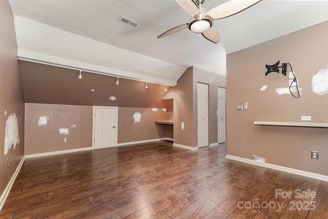 2001 Enderbury Dr, Indian Trail, NC 28079 - unfurnished living room with vaulted ceiling, a ceiling fan, and wood finished floors