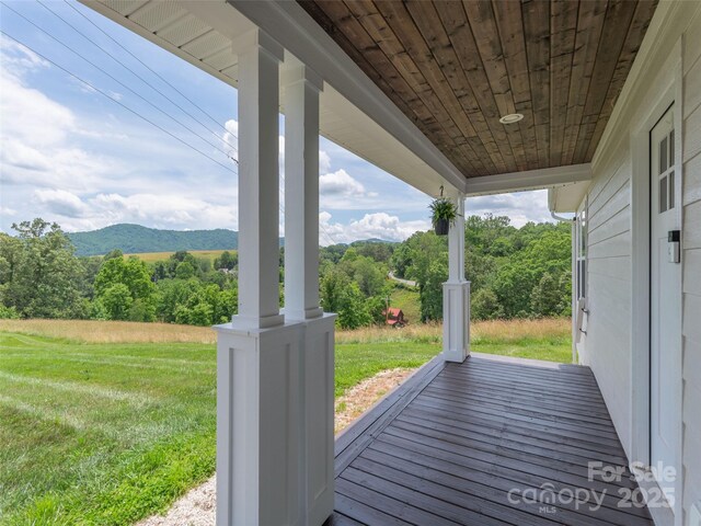 3355 Thickety Rd, Clyde, NC 28721 - wooden terrace with a lawn and a mountain view