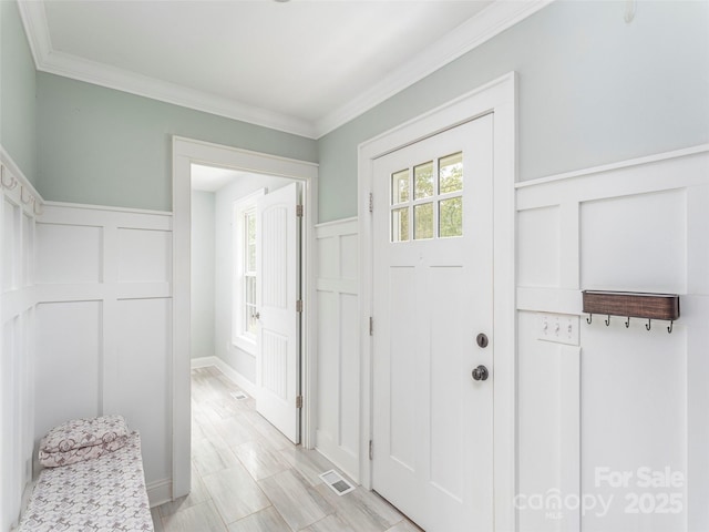 3355 Thickety Rd, Clyde, NC 28721 - foyer entrance with a decorative wall, ornamental molding, and wainscoting