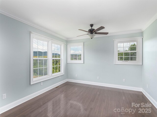 3355 Thickety Rd, Clyde, NC 28721 - unfurnished room featuring plenty of natural light, dark wood-type flooring, ceiling fan, and crown molding
