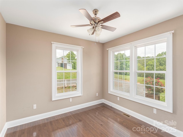 3355 Thickety Rd, Clyde, NC 28721 - empty room featuring dark wood-style flooring and a ceiling fan