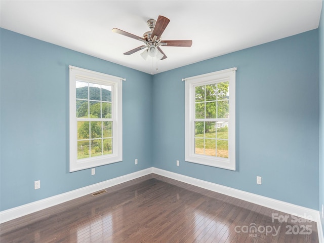3355 Thickety Rd, Clyde, NC 28721 - spare room with dark wood-style flooring and ceiling fan