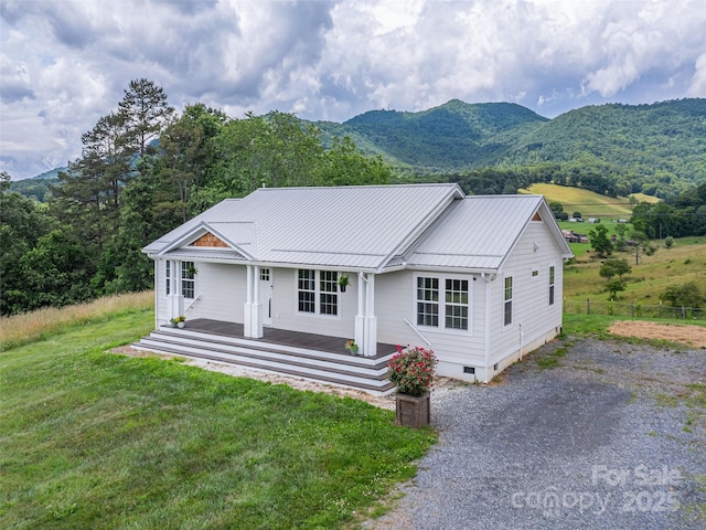 3355 Thickety Rd, Clyde, NC 28721 - view of front facade featuring crawl space, a metal roof, a front yard, and a standing seam roof