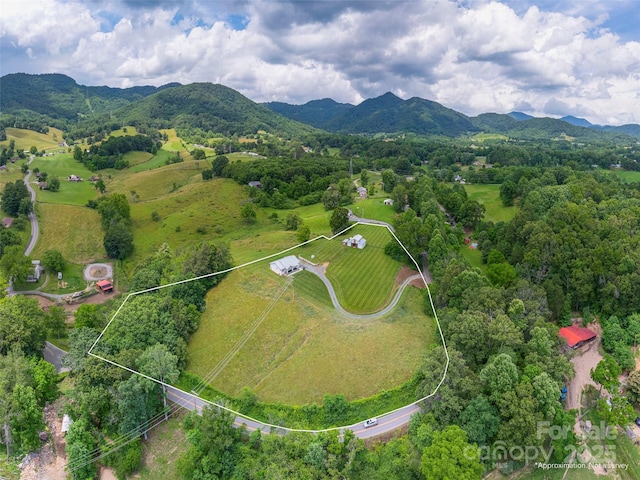 3355 Thickety Rd, Clyde, NC 28721 - aerial view of property and surrounding area featuring a mountainous background and property parcel outlined