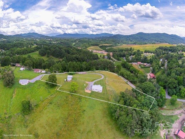 3355 Thickety Rd, Clyde, NC 28721 - aerial view of property and surrounding area with property boundaries highlighted and a mountain backdrop