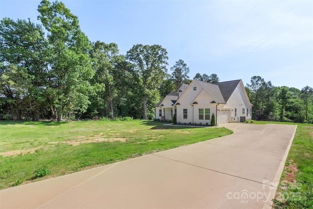 8680 Sherrills Ford Rd, Sherrills Ford, NC 28673 - view of front of house with a garage, driveway, board and batten siding, and a front yard
