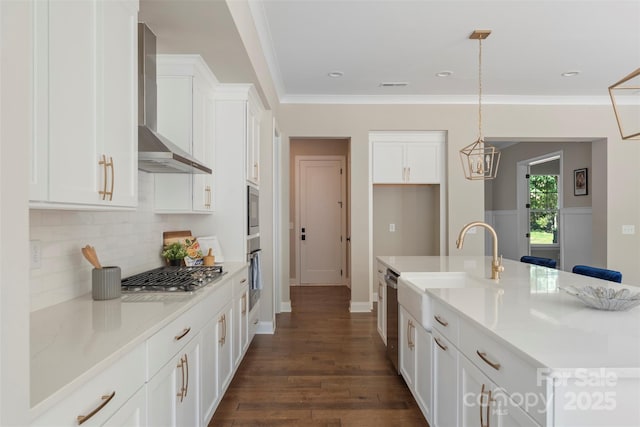 8680 Sherrills Ford Rd, Sherrills Ford, NC 28673 - kitchen featuring wall chimney exhaust hood, appliances with stainless steel finishes, decorative backsplash, white cabinetry, and crown molding