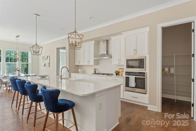 8680 Sherrills Ford Rd, Sherrills Ford, NC 28673 - kitchen featuring stainless steel appliances, wall chimney exhaust hood, dark wood-style flooring, light countertops, and white cabinetry
