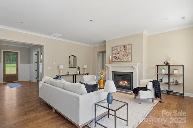 8680 Sherrills Ford Rd, Sherrills Ford, NC 28673 - living area featuring wood finished floors, a glass covered fireplace, crown molding, and recessed lighting