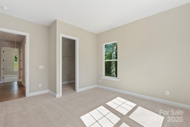 8680 Sherrills Ford Rd, Sherrills Ford, NC 28673 - unfurnished bedroom featuring attic access, carpet, a spacious closet, and a closet